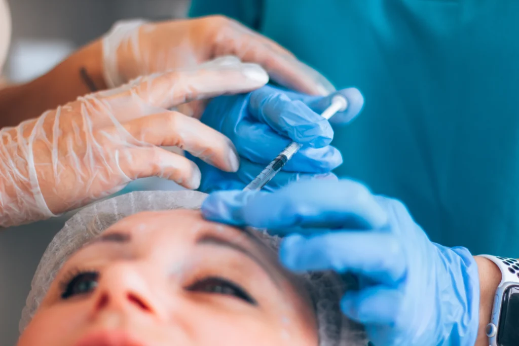 A close-up of a patient receiving dermal fillers during a professional procedure.